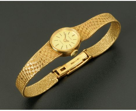 A ladies Tissot 9 ct gold cased wristwatch, Tissot Saphir, with gold bracelet and clasp, 18.8 grams gross.    CONDITION REPOR