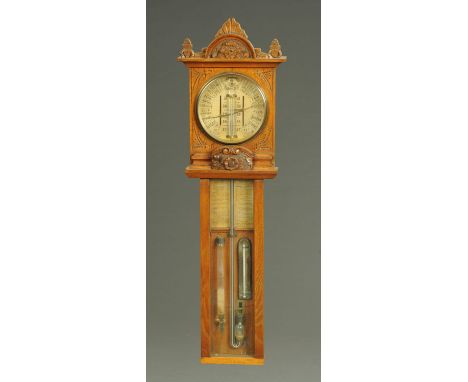 A late Victorian carved oak cased barometer, "Improved Barometer, Torricelli".  Height 111 cm, width 34.5 cm (see illustratio