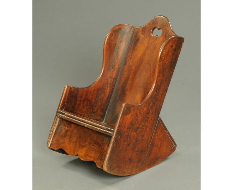 An early 19th century child's rocking chair, with commode seat.  Width 37 cm.   CONDITION REPORT:  The seat top is not hinged