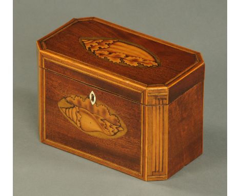 A George III inlaid mahogany tea caddy, shell inlaid and with canted angles.  Width 18.5 cm (see illustration).   CONDITION R