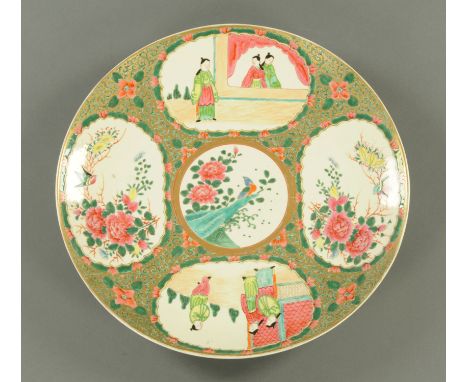 A Chinese 18th century Canton Famille Rose charger, with six character mark verso.  Diameter 46 cm.    CONDITION REPORT:  Ver