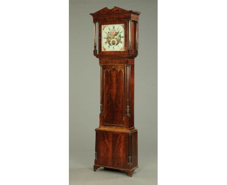 A Regency mahogany longcase clock, the movement by Wood of Cheetham, with two-train striking movement and moon phase, the cas