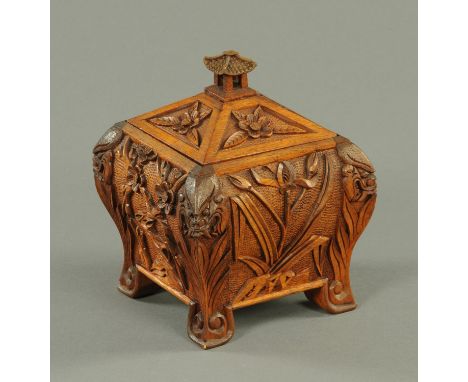 A 19th century Chinese carved wooden tea caddy, decorated with dragons and foliage.  Height 20 cm.    CONDITION REPORT:  Ther