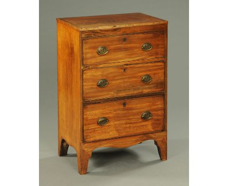 A George III mahogany chest of drawers, with three drawers with brass drop handles with oval pavilion backplates and cockbead