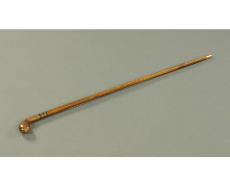 A one piece fruitwood Sabbath Day (golf practice) walking stick, circa 1890.