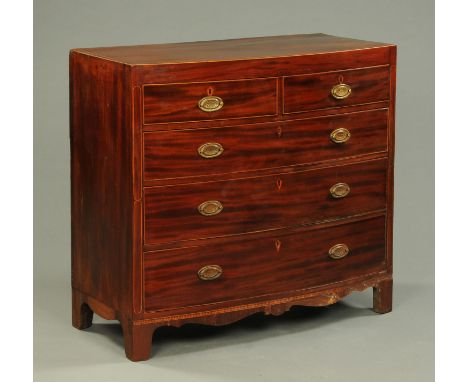 An early 19th century mahogany rosewood crossbanded and boxwood strung chest of drawers, with two short and three long gradua