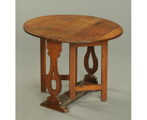 A Georgian oak drop leaf gate leg table.  Width 78 cm.    CONDITION REPORT:  Height 27 ins.  The table top is not warped. The