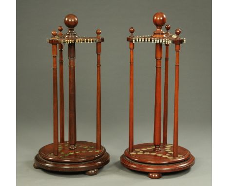 A pair of mahogany revolving snooker and billiard cue stands.  Height to top of finial 120 cm (see illustration).   CONDITION