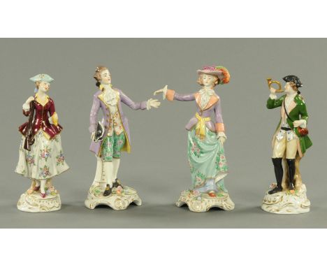 Four Continental porcelain figurines, each with floral encrusted bases.  Height 19 cm.   CONDITION REPORT:  The larger pair o
