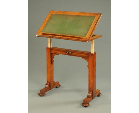 A Victorian mahogany adjustable reading table, with book rest, silhouette ends and short bun feet with castors.  Width 89 cm 