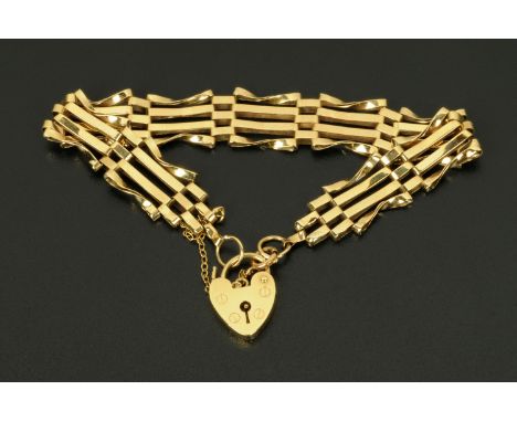A 9 ct gold gate bracelet, with padlock and safety chain, 9.3 grams. 