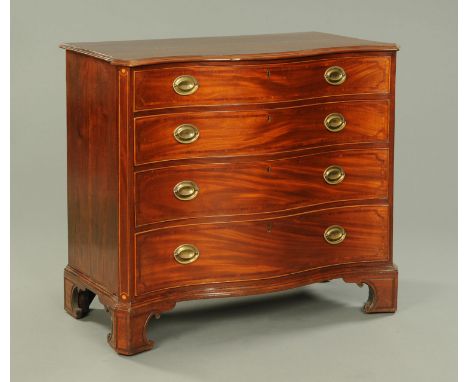 A George III mahogany serpentine fronted chest of drawers, with canted angles, four long graduated drawers with brass drop ha