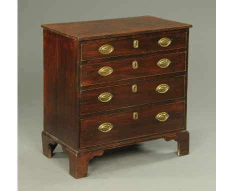 A George III mahogany chest of drawers, with four long graduated drawers with brass drop handles and brass lock escutcheons a