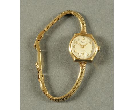 A 9 ct gold cased ladies Rotary wristwatch, with snake bracelet, Arabic numerals and subsidiary seconds dial.  Diameter 22 mm