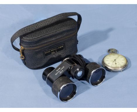 A pair of vintage opera glasses and a stop watch