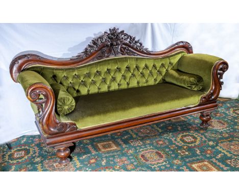 Victorian button back settee with carved mahogany frame