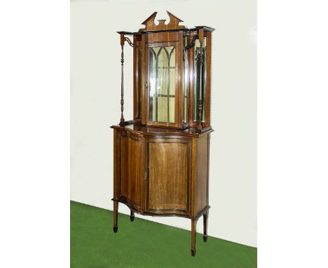 An Edwardian inlaid mahogany display cabinet on cupboards with serpentine front.  206cm tall 90cm wide and 46cm deep