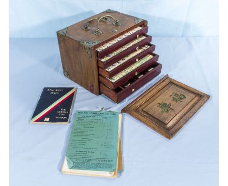 A vintage mahjong set in wooden carrying case