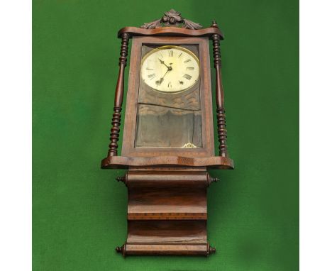 An Edwardian inlaid mahogany wall clock in need of restoration