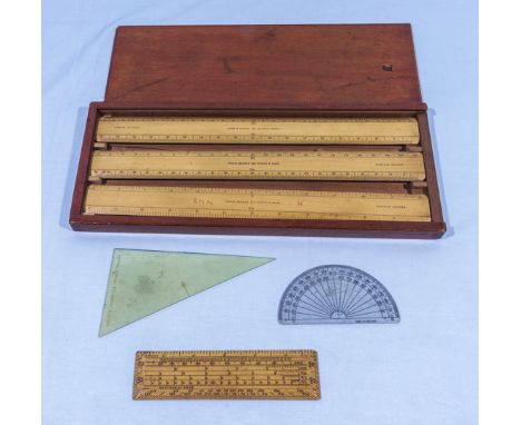 Three vintage wooden rulers in fitted box and three other items