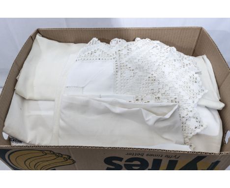 A box containing vintage table linen 