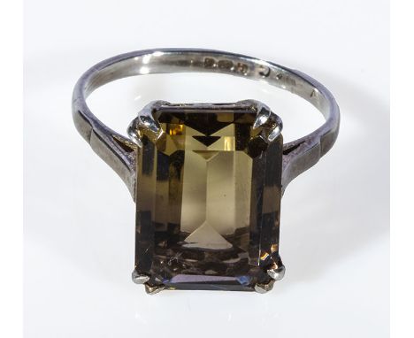 A lady's silver ring set with a topaz
