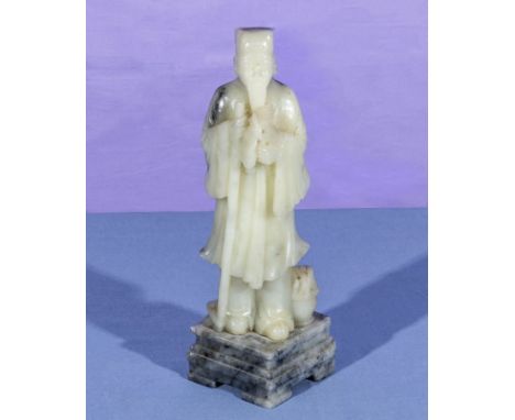 A Chinese white jade figure of a sage, 25cm tall