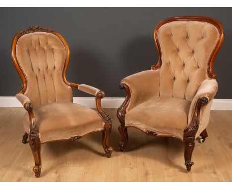 Two similar Vicotrian mahogany framed armchairs with button back upholstery, one larger than the other, both with carved orna