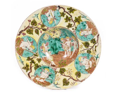 Hannah Jones for Della Robbia, a charger, with underglaze enamel decoration of cherubs, 37cm diameter, painters mark HJ to th