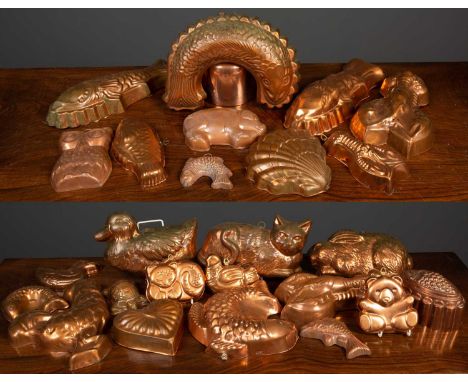 A group of copper moulds to include lobster shaped, fish shaped, rabbit shaped, cat shaped and further, together with a large