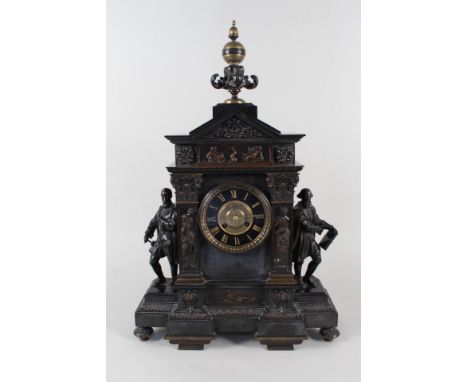 A 19th Century French black marble and patinated brass mantel clock, the top globe over acanthus leaves, the front with paint