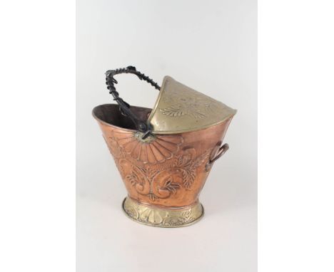 An embossed copper and brass coal helmet with wrought iron handle and inscription 'First Class Awaiting Room'