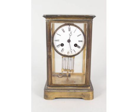 A brass four sided glass mantel clock with mercury pendulum (chipped dial)