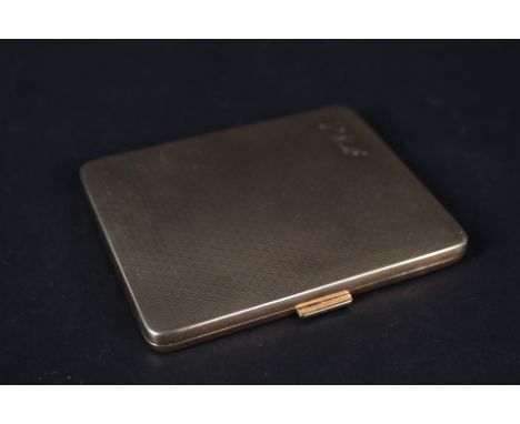 A 9ct gold cigarette case with engine turned decoration (inscription inside case)