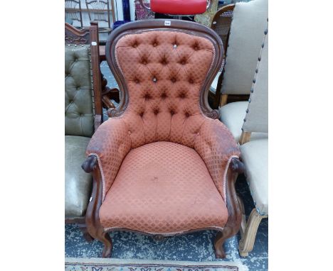 A VICTORIAN SHOW FRAME BUTTON BACK ARM CHAIR. 