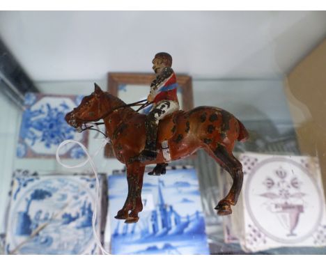A SMALL COLD PAINTED BRONZE HORSE AND JOCKEY. 