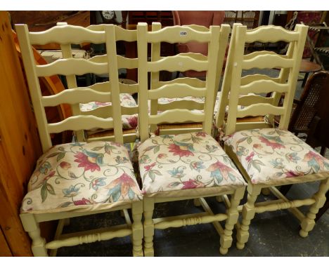 A SET OF SIX RUSH SEAT LADDER BACK PAINTED CHAIRS, AND A PINE TOPPED EXTENDING BREAKFAST TABLE. 