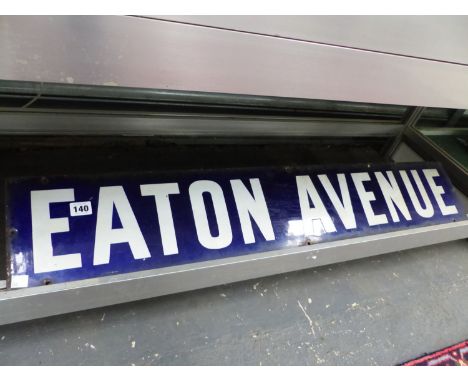 A BLUE AND WHITE ENAMEL STREET SIGN "EATON AVENUE"