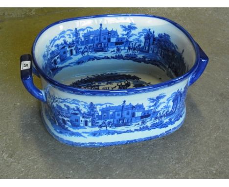 A large blue and white Ironstone style footbath/planter 