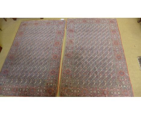 A pair of vintage red ground hand knotted woolen Persian meshed rugs with Boteh design 214cm x 134cm
Condition report: Genera