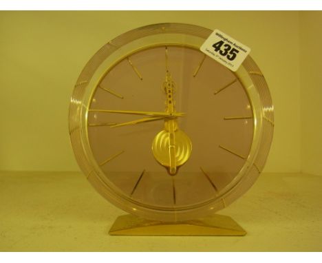 A Jaeger le Coultre lacquered brass and perspex desk clock, manual wind with exposed escapement - Diameter 14 cm 
Condition r