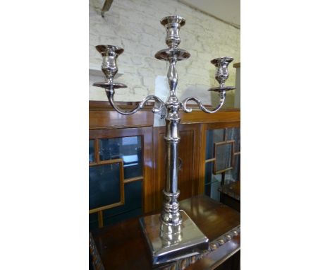 A singular three light candelabrum 