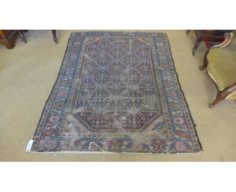 A vintage blue ground hand knotted Persian rug with stylized floral decoration - 200 x 147 cm
Condition report:  Heavy wear, 