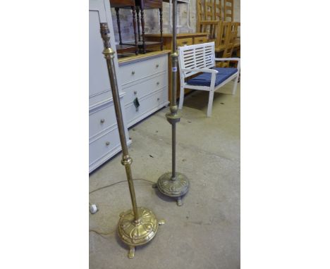 A brass extending standard lamp and a similar standard lamp