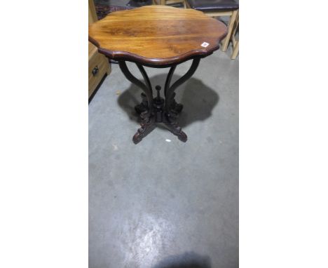 A Victorian style mahogany lamp table with shaped top - Height 73 cm x 65 cm x 50 cm 