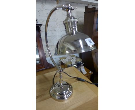 A circular base nickel plated desk lamp 
Condition report: Lamp wired and PAT tested
