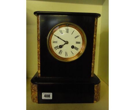 An eight day slate striking mantel clock
