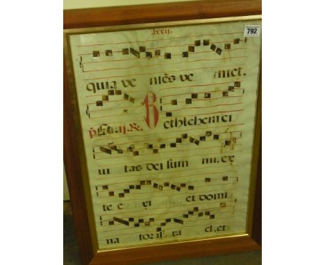 A late Medival vellum manuscript being a double sided leaf from a choir book - framed and glazed - 52 cm x 36 cm 