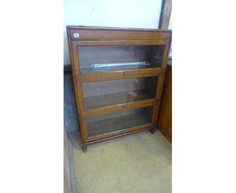 An oak three section stacking bookcase - some shelves cut to add lighting  - Height 1.17 m x Width 87 cm x Depth 31 cm 