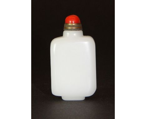 A lovely white jade snuff bottle with a gilt and coral stopper H 5.2cm
